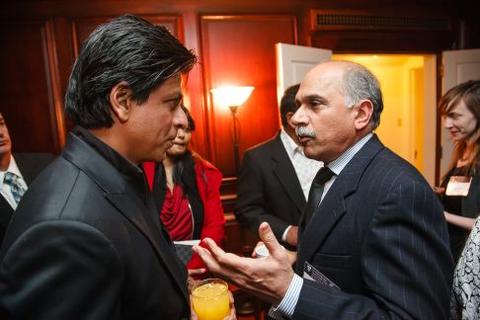Shah Rukh Khan speaks to guests at Timothy Dwight College Fellows reception