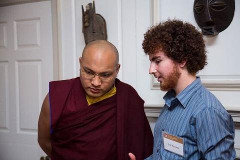 Ogyen Trinley Dorje speaks with a guest at Chubb Fellowship reception
